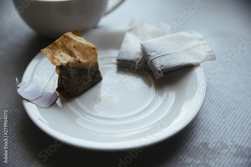 Tea bags on small plate front view