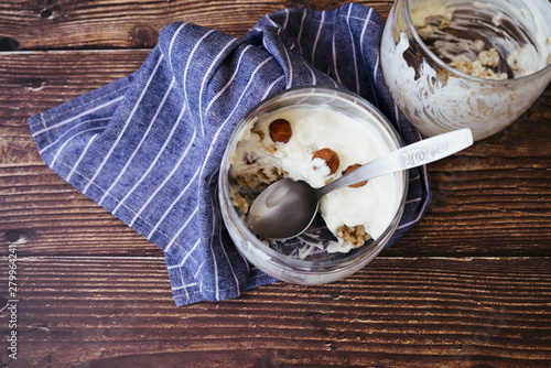 Healthy yogurt and oats breakfast on wooden table photo