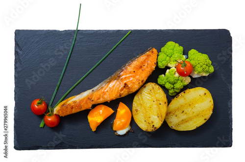 Fototapeta Grilled salmon with egg yolk and vegetables