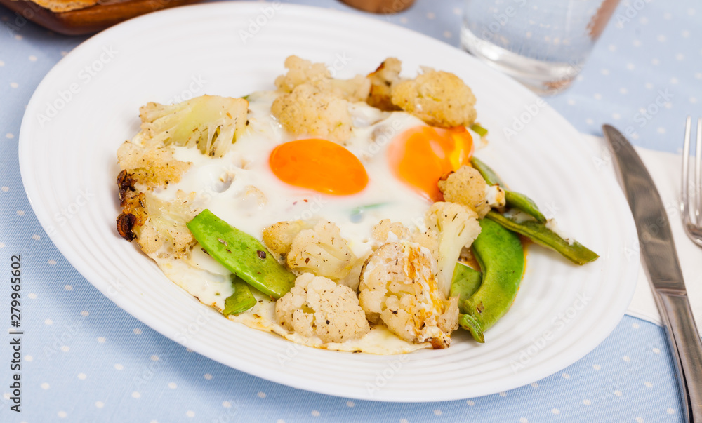 Appetizing cauliflower fried eggs for breakfast