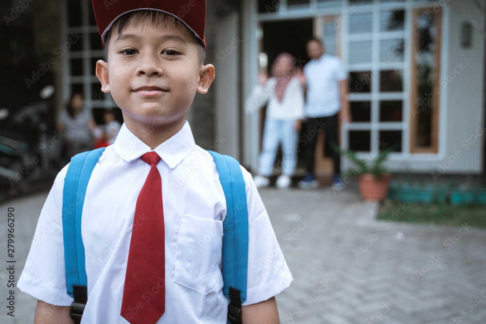 portrait of asian elementary student going to school from home in the morning