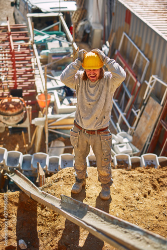 Construction worker on a heavy site doing hard work.