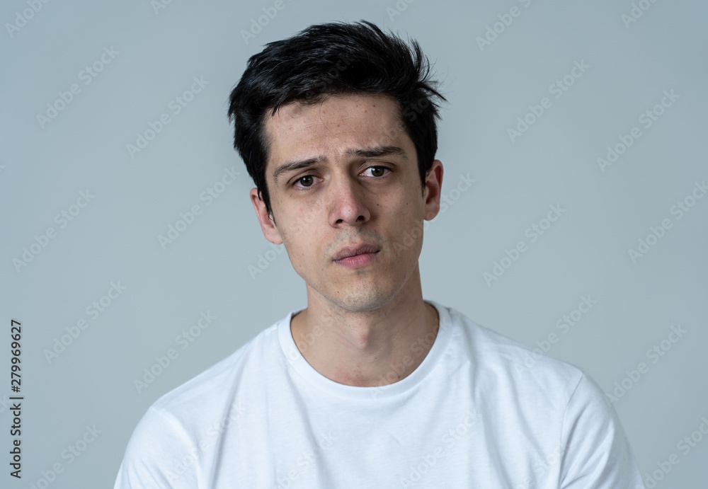 Portrait of sad and depressed man. Isolated on neutral background. Human expressions and emotions Portrait of sad and depressed man. Isolated on neutral background. Human expressions and emotions