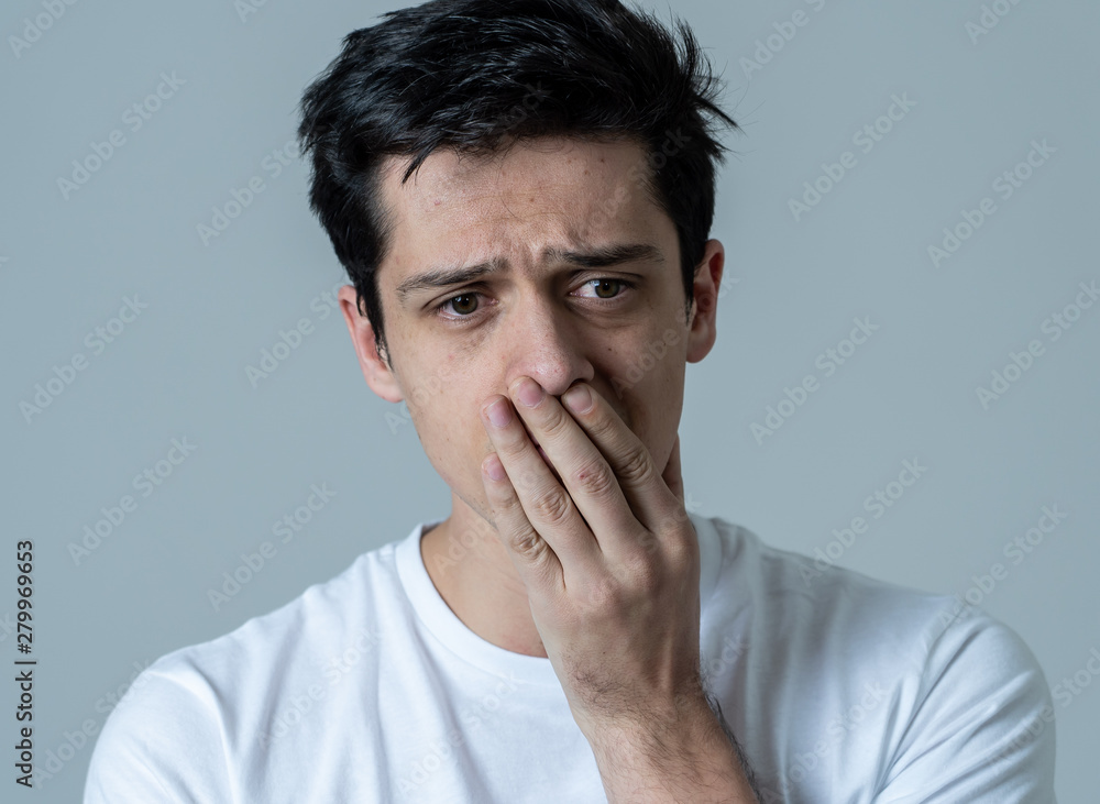 Portrait of sad and depressed man. Isolated on neutral background. Human expressions and emotions Portrait of sad and depressed man. Isolated on neutral background. Human expressions and emotions
