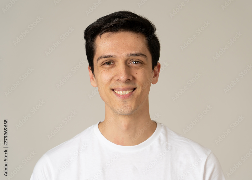 Portrait of young attractive cheerful man with smiling happy face. Human expressions and emotions Portrait of young attractive cheerful man with smiling happy face. Human expressions and emotions