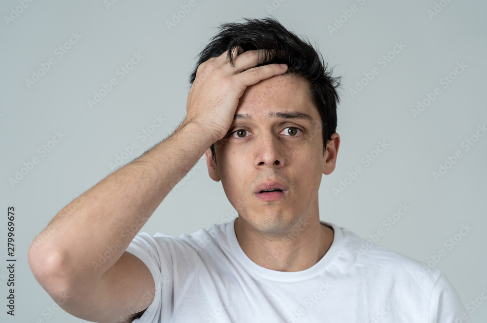 Portrait of sad and depressed man. Isolated on neutral background. Human expressions and emotions Portrait of sad and depressed man. Isolated on neutral background. Human expressions and emotions