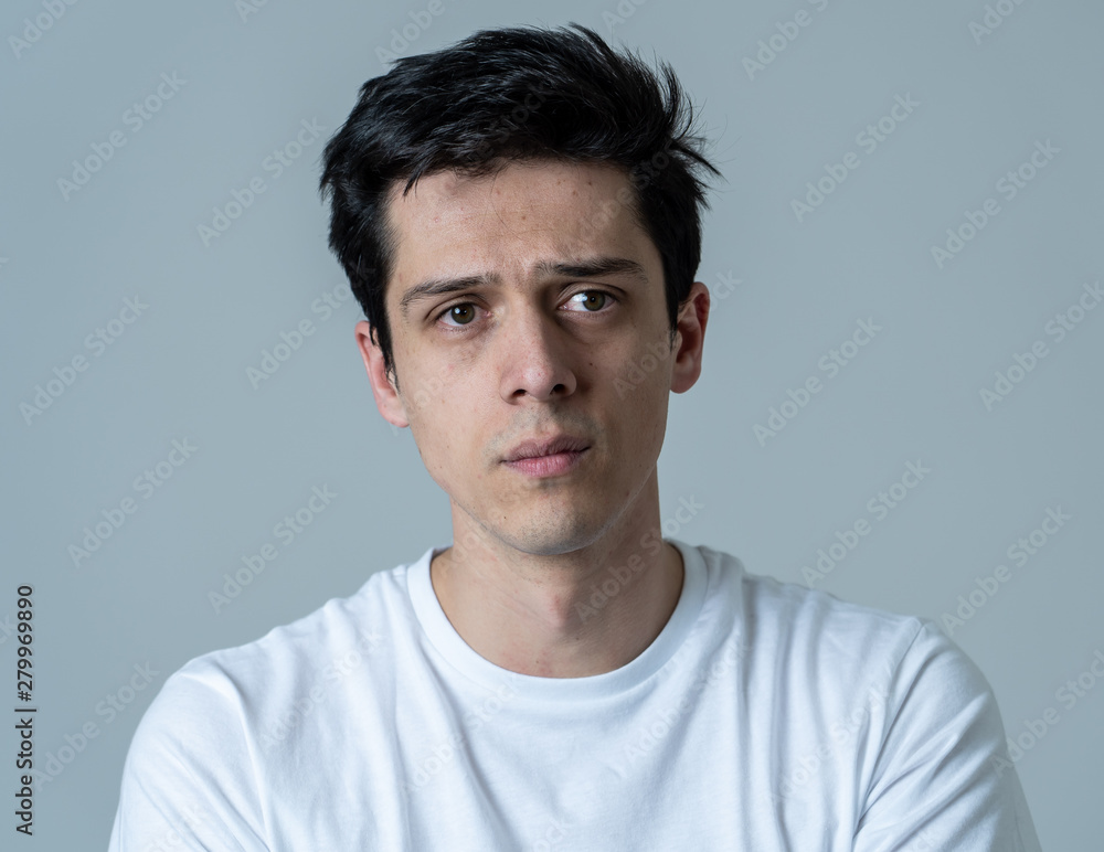Portrait of sad and depressed man. Isolated on neutral background. Human expressions and emotions Portrait of sad and depressed man. Isolated on neutral background. Human expressions and emotions