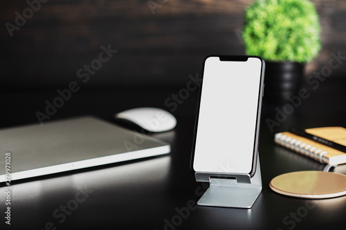 phone on holder show white screen workspace background