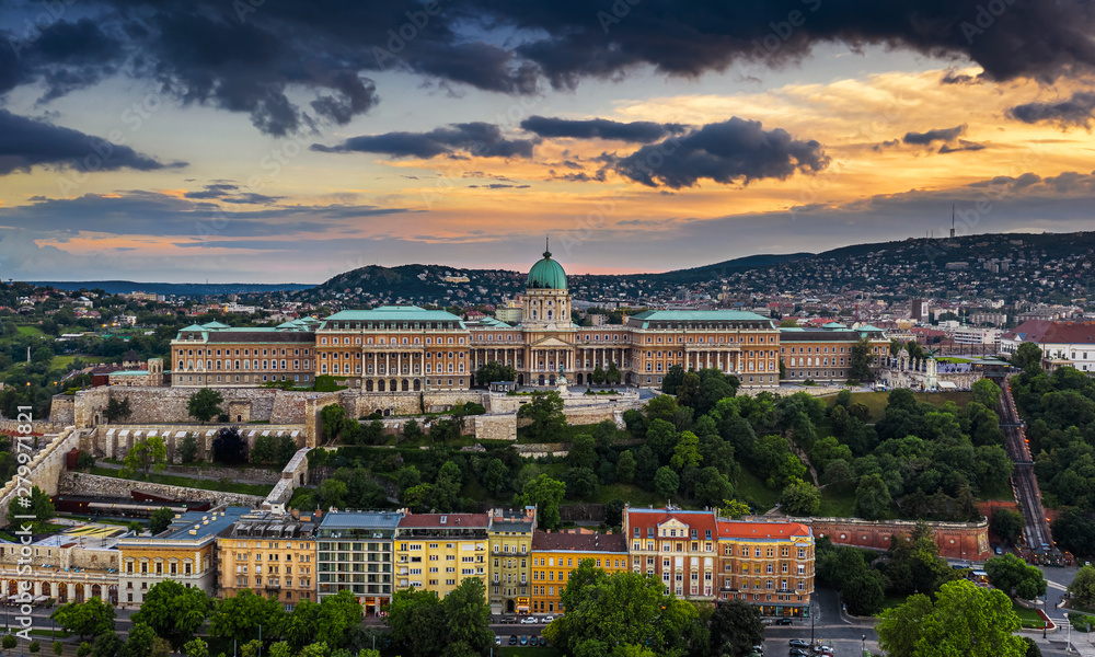 Budapest, Hungary - Dramatic golden sunset over Buda Castle Royal Palace at summer time taken with a drone