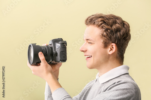Teenage boy with photo came...