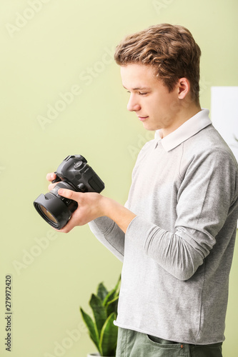 Teenage boy with photo came...