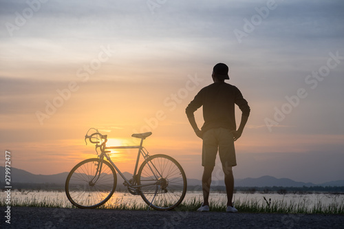 Cyclist on background of sunset  sport and travel concept