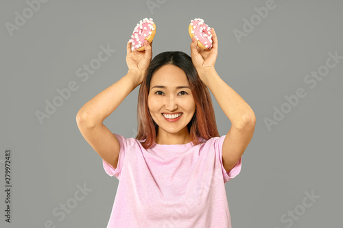 Funny Asian woman with tast...