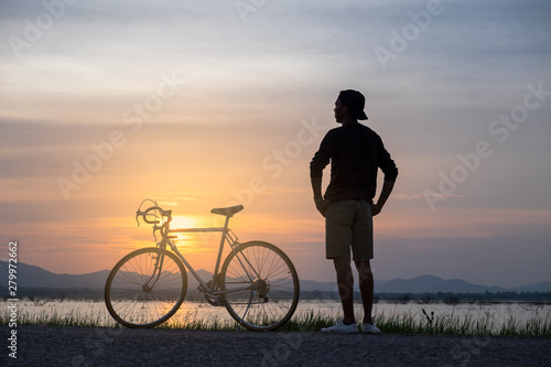 Cyclist on background of sunset  sport and travel concept