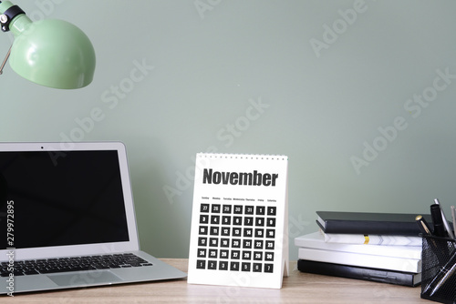 Calendar with laptop and st...