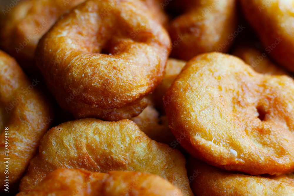 golden sweet donuts fried in sunflower oil,harmful street food fast cooking golden sweet donuts fried in sunflower oil,harmful street food fast cooking