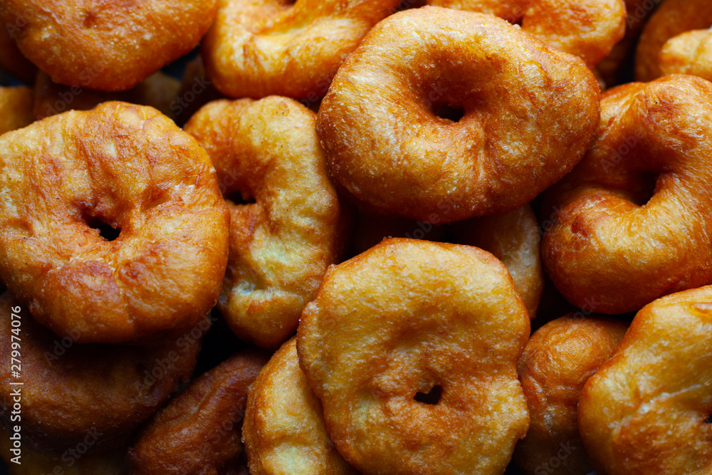 golden sweet donuts fried in sunflower oil,harmful street food fast cooking golden sweet donuts fried in sunflower oil,harmful street food fast cooking