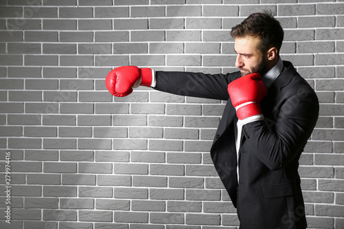 Businessman in boxing glove...