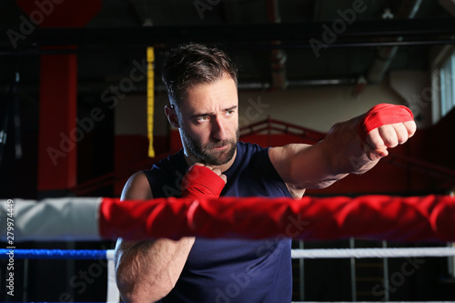 Sporty man in boxing ring © Pixel-Shot