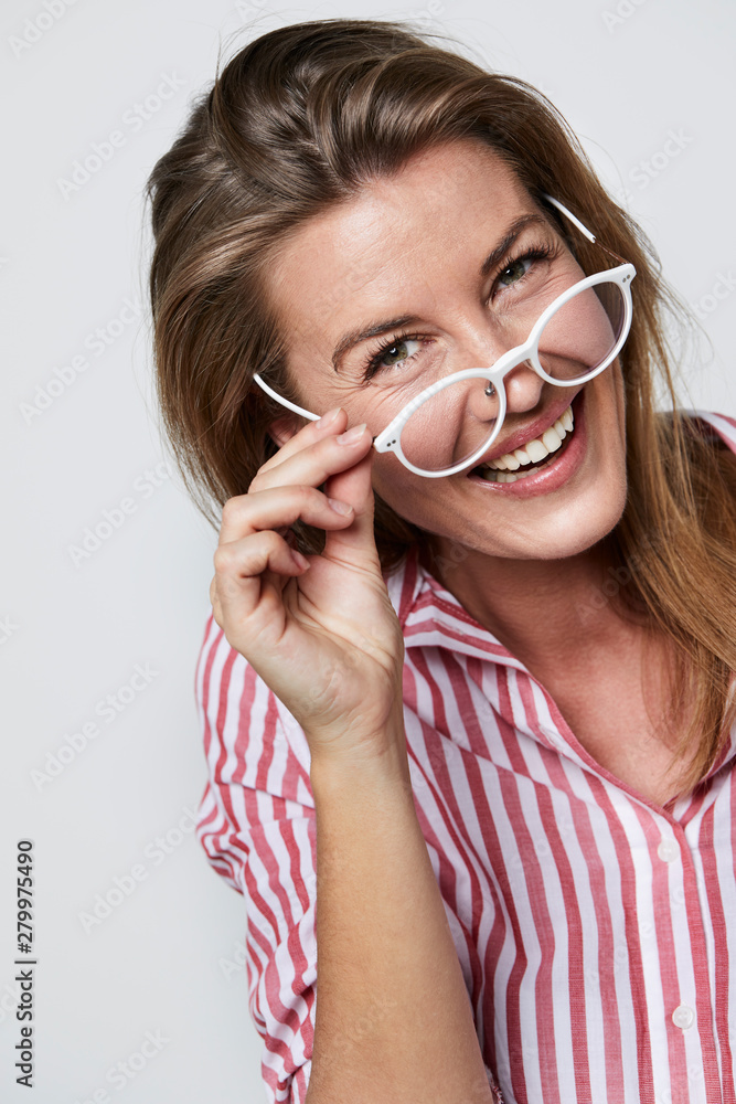Laughing lady in white framed glasses, portrait Laughing lady in white framed glasses, portrait