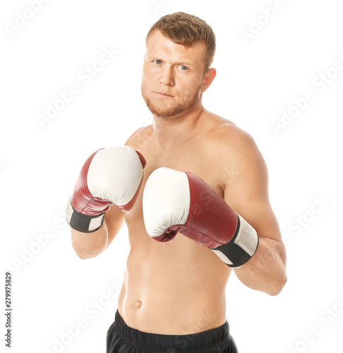 Strong male boxer on white ...
