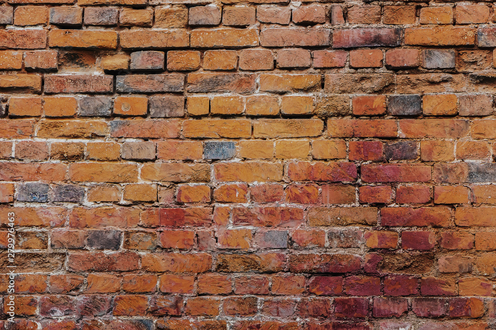 Fototapeta premium Beautiful horizontal texture of part of a old crashed brick gray wall is on the photo