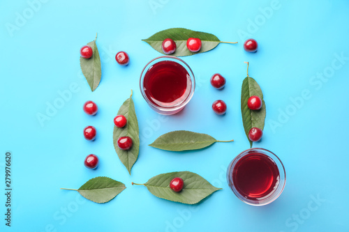 Composition with fresh cherry and juice on color background