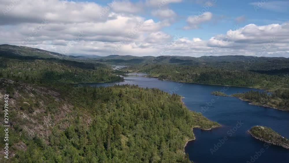Aerial, hyperlapse drone shot, over the coast of lake Straumsfjorden, overlooking hills, forest and Norwegian wilderness, cloud shadows moving on the ground, on a summer day, in Aust-agder, Norway Aerial, hyperlapse drone shot, over the coast of lake Straumsfjorden, overlooking hills, forest and Norwegian wilderness, cloud shadows moving on the ground, on a summer day, in Aust-agder, Norway