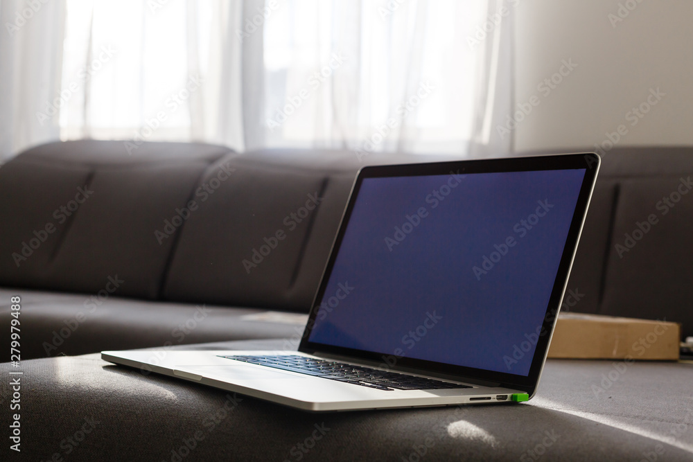 laptop on the sofa with nobody, concept of working at home laptop on the sofa with nobody, concept of working at home