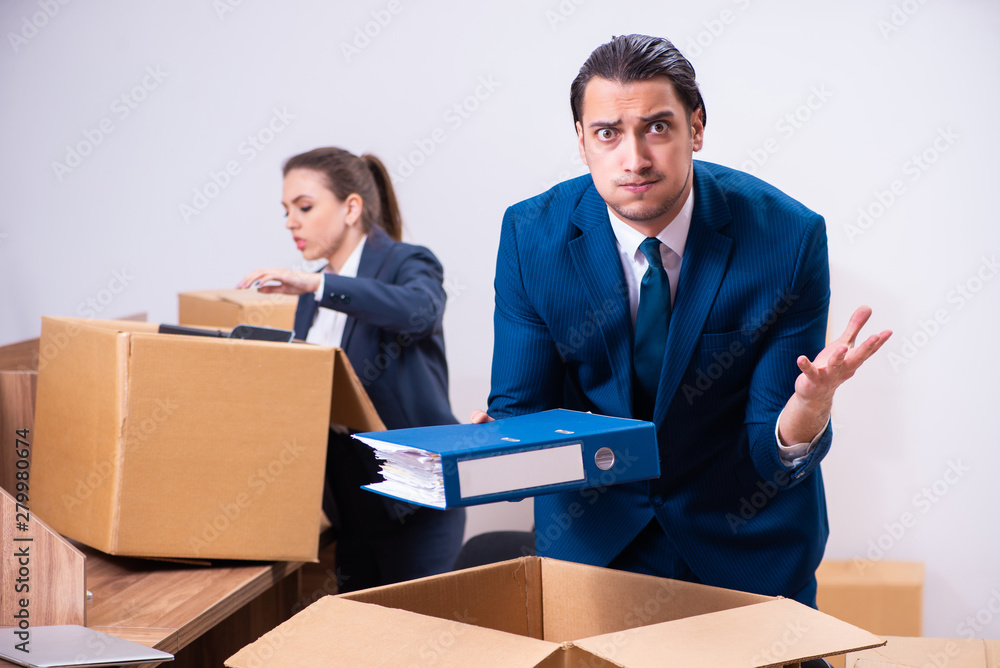 Two employees being fired from their work Two employees being fired from their work