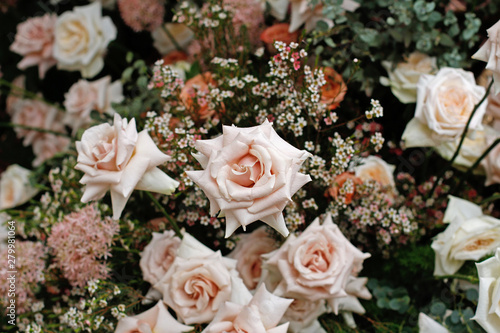 A bouquet of beautiful roses, allium and gypsophilas at the spring festival