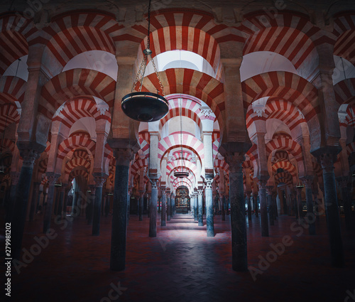 Interior of Cordoba Mosque Cathedral with its beautiful white and red arches - Cordoba, Andalusia, Spain photo