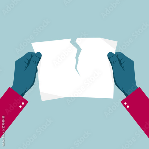 Tears the paper with both hands. Isolated on blue background.