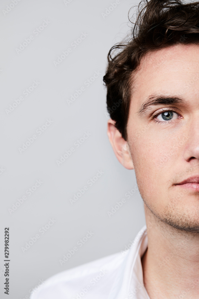 Fototapeta premium Portrait of blue eyed man, studio