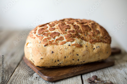 freshly baked sourdough bread loaf on the table rustic