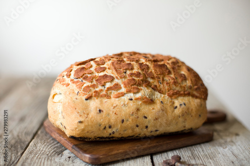 freshly baked sourdough bread loaf on the table rustic
