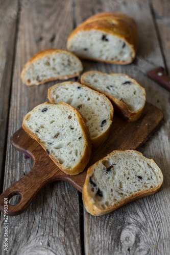 sliced sourdough bread loaf on the wooden table flat lay
