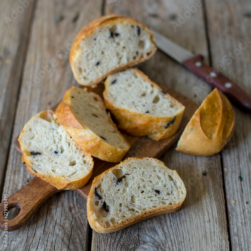 sliced sourdough bread loaf on the wooden table flat lay