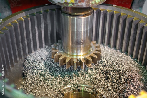 Gear-cutting production at a machine-building enterprise, production of a gear wheel on a machine, with oil cooling. photo