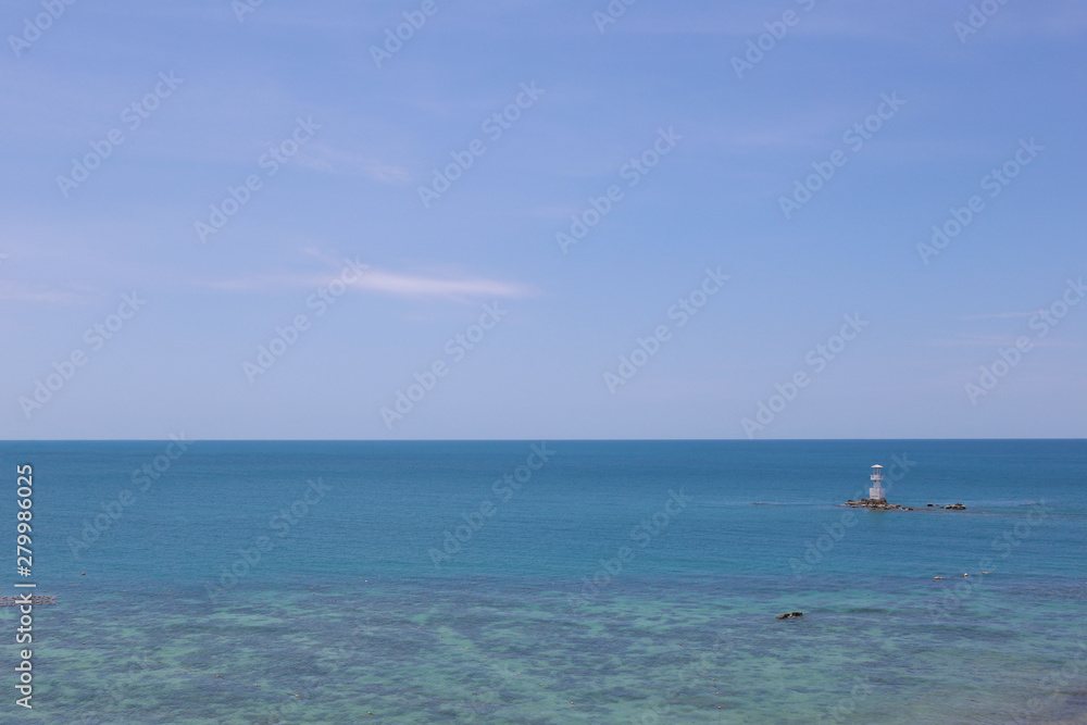 Lighthouse in sea and blue sky on daytime,Tropical sea in Thailand.