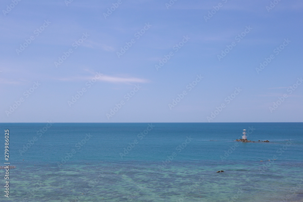Lighthouse in sea and blue sky on daytime,Tropical sea in Thailand. Lighthouse in sea and blue sky on daytime,Tropical sea in Thailand.