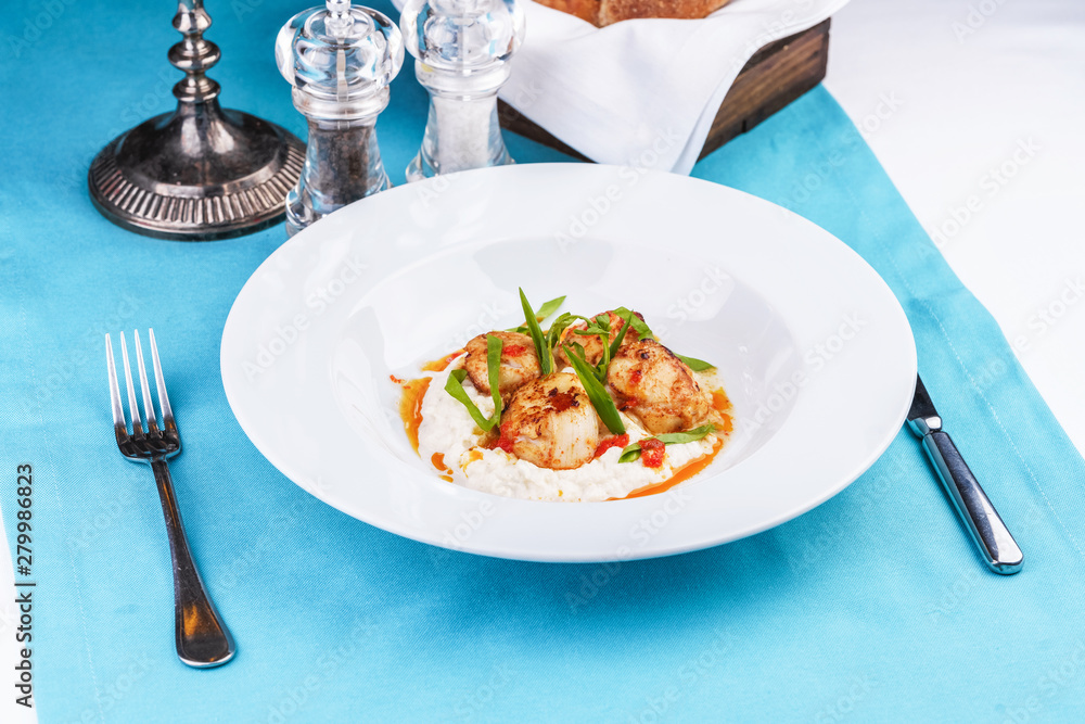 Mediterranean fish on a mashed potato pillow with tomato sauce Mediterranean fish on a mashed potato pillow with tomato sauce