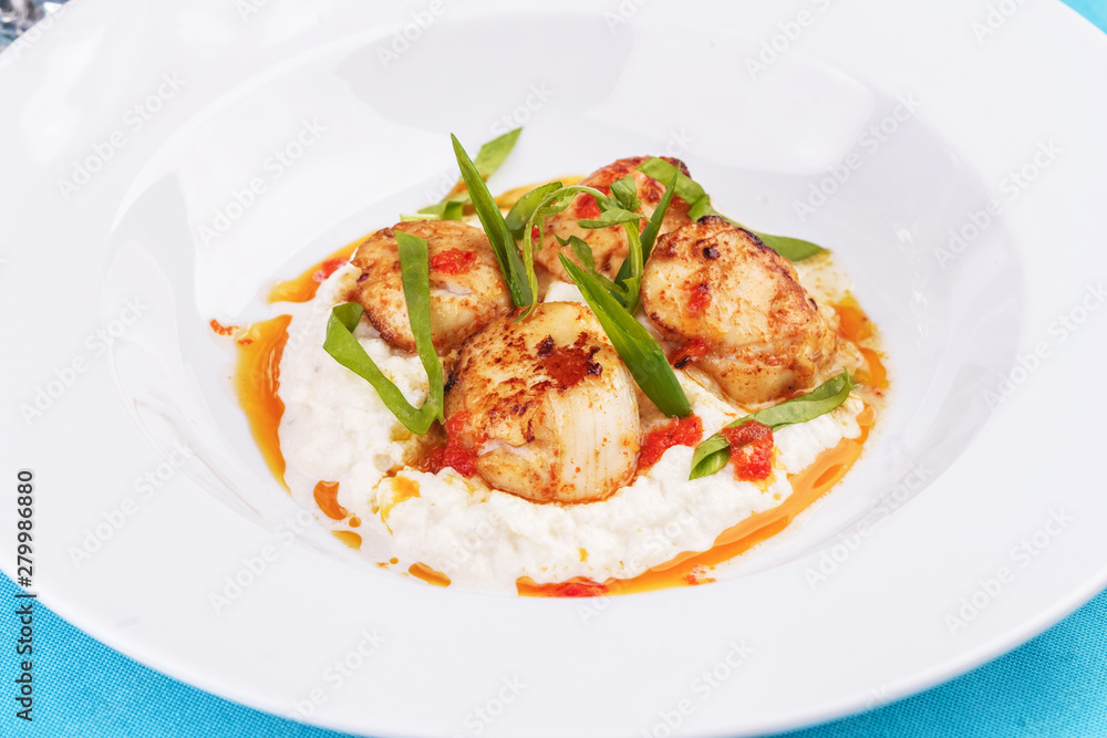 Mediterranean fish on a mashed potato pillow with tomato sauce Mediterranean fish on a mashed potato pillow with tomato sauce