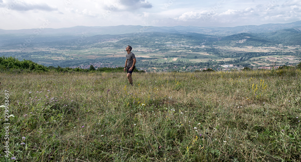 Fototapeta premium Hiker enjoying in the mountain