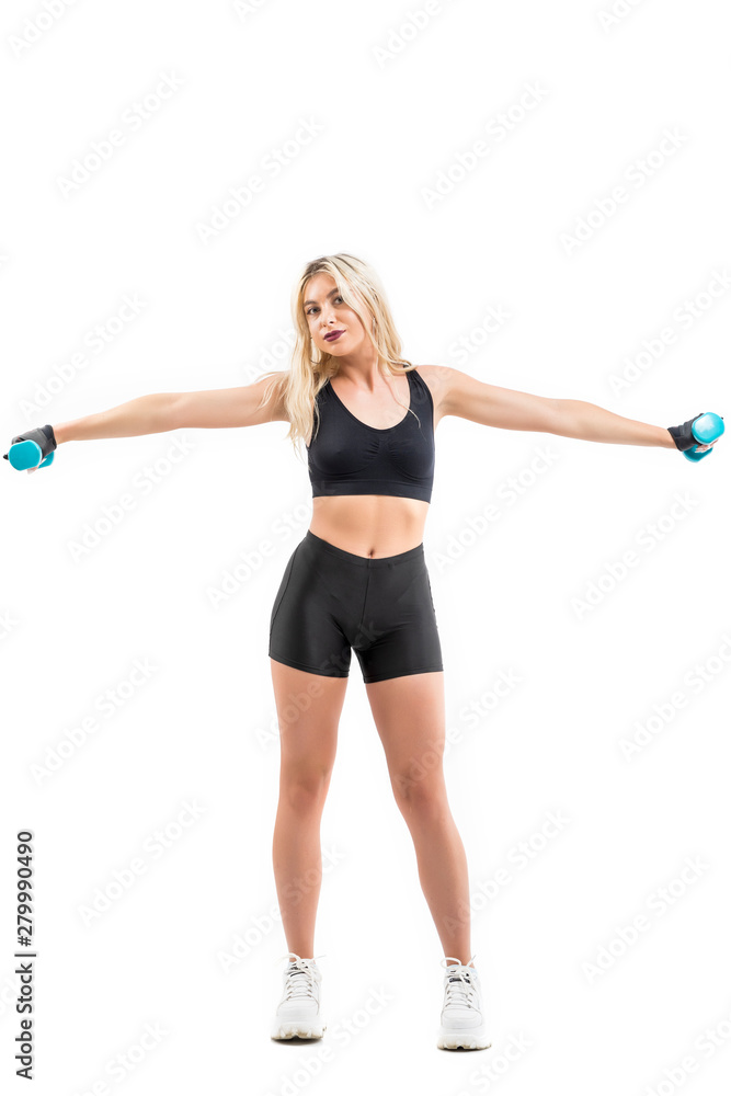 Beautiful fit woman exercising with dumbbells Beautiful fit woman exercising with dumbbells