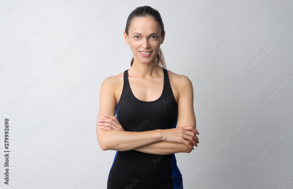 portrait of a young fitness woman in sportswear posing isolated portrait of a young fitness woman in sportswear posing isolated