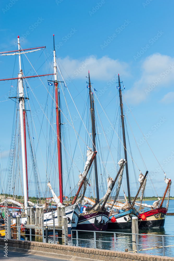 Ships in a row in a harbor. Terschelling, The Netherlands, Europe. Ships in a row in a harbor. Terschelling, The Netherlands, Europe.
