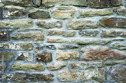 texture of masonry, a fragment of a stone wall of an ancient temple of the 10th century, background, backdrop photo