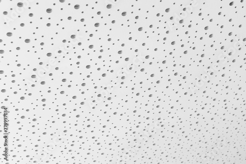 White ceiling structure with small holes