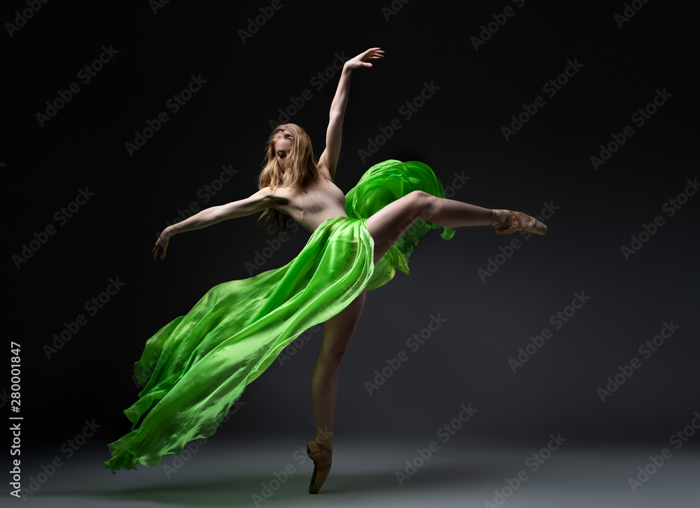 female ballet dancer in green skirt in wind movement female ballet dancer in green skirt in wind movement